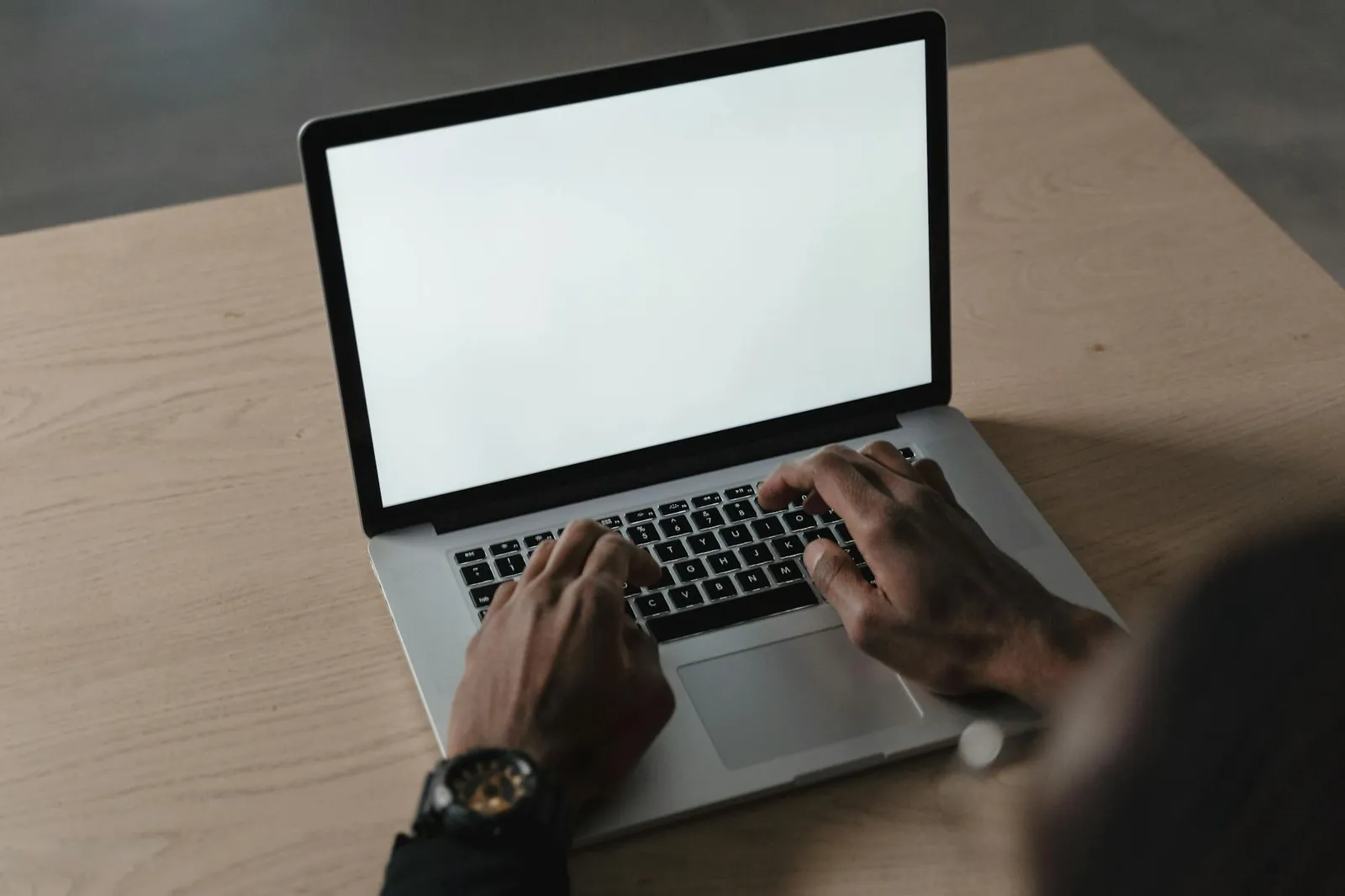 Computer next to documents, suggesting a template and resume editing.