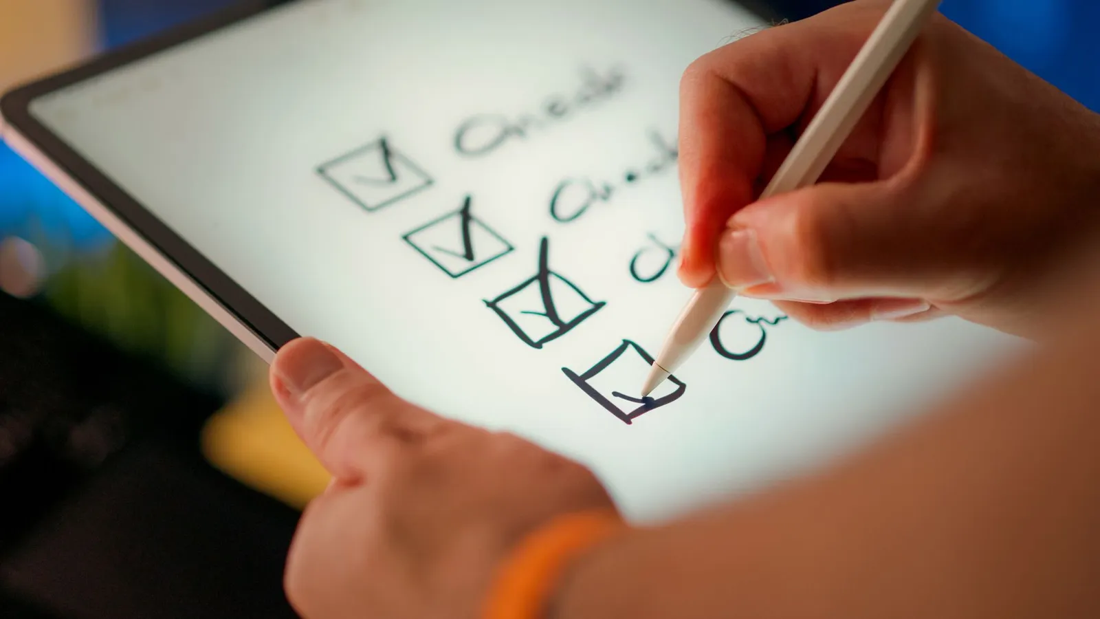 Hands organizing a checklist and marking tasks, symbolizing daily discipline at work.